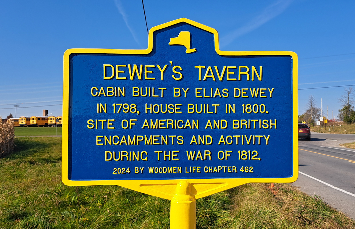 Dewey's
              Tavern blue and yellow historic marker and interpretive
              panels, Town of Champlain, New York