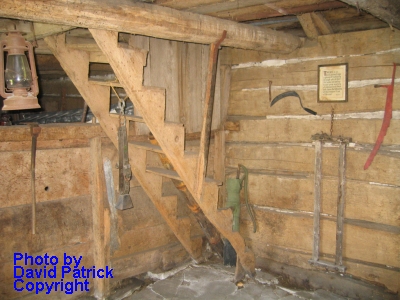 Dewey's tavern log
                  cabin built in 1797; interior staircase